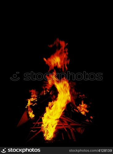 Flames of a fire at night