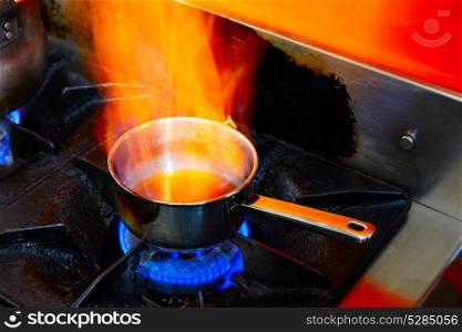 Flaming Cooking Pan in restaurant kitchen with fire