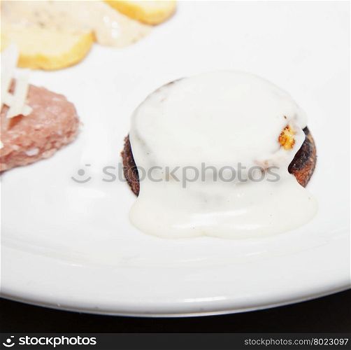 Flan with cheese over white palte, horizontal image