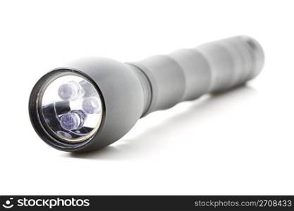 flashlight. one black flashlight on white background