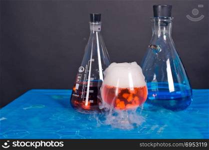 ""Flask and a glass of dry ice.A chemical reaction in action""