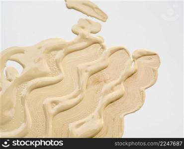 flat lay abstract foundation stain white background