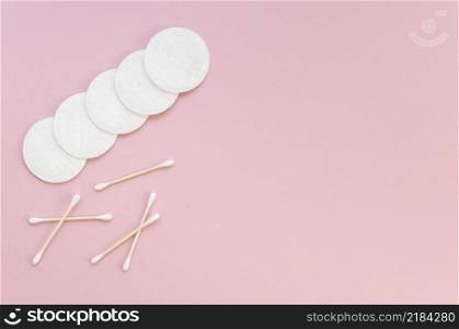 flat lay arrangement with cotton pads ear sticks