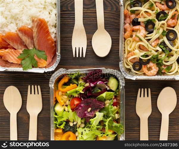 flat lay arrangement with different meals wooden table