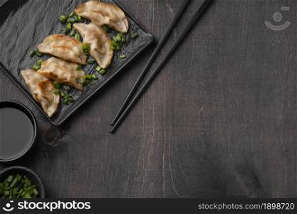 flat lay asian dumplings dish slate with copy space. Resolution and high quality beautiful photo. flat lay asian dumplings dish slate with copy space. High quality beautiful photo concept