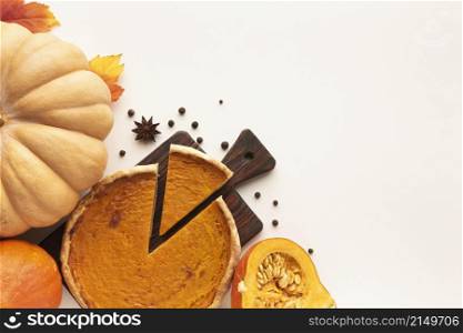 flat lay assortment with sliced pie pumpkin