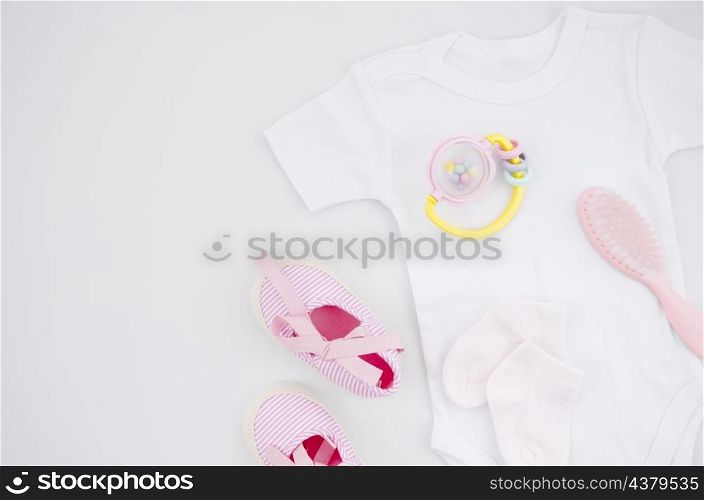 flat lay baby clothes with white background