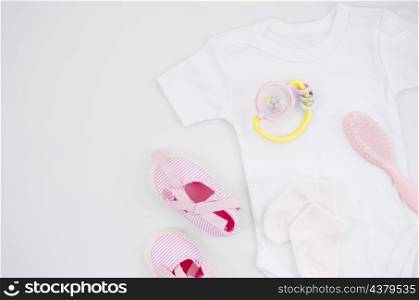 flat lay baby clothes with white background