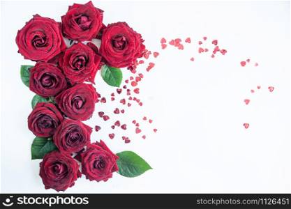 Flat Lay Background, flower pattern, Valentine&rsquo;s Day, the theme of lovers. Red roses on a white background, isolated. Space for texr