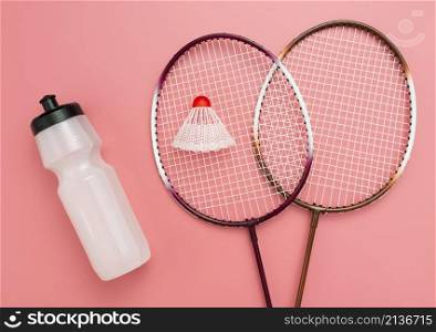 flat lay badminton set with water bottle
