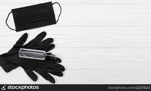 flat lay black medical mask gloves with copy space