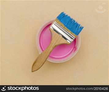 flat lay blue brush pink paint bucket
