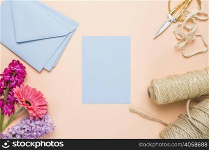 flat lay blue wedding invitations with envelopes
