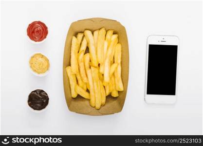 flat lay box fries with sauces smartphone mock up