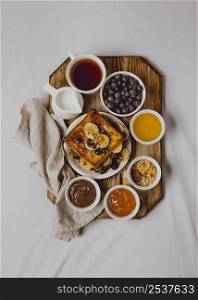 flat lay breakfast toast with banana blueberries