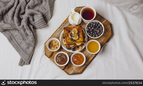 flat lay breakfast toast with blueberries banana
