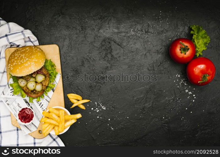 flat lay burger fries wooden board with copyspace