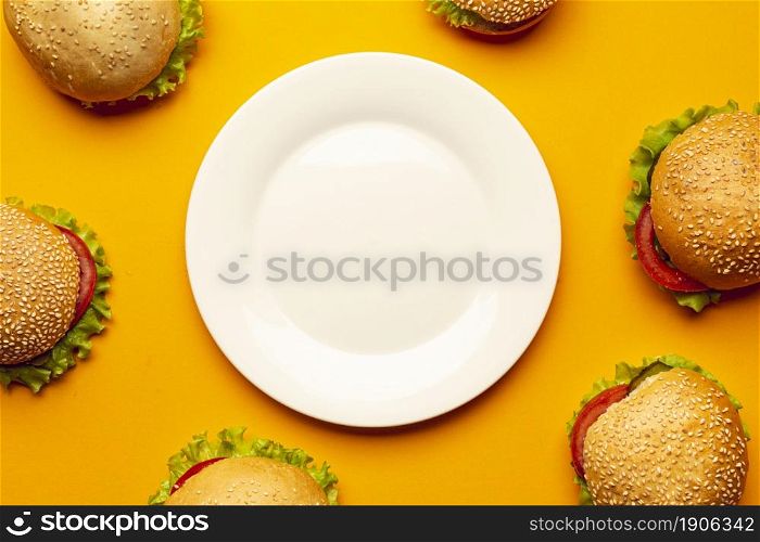 flat lay burgers with empty plate. High resolution photo. flat lay burgers with empty plate. High quality photo