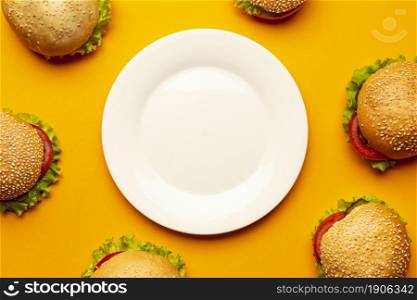 flat lay burgers with empty plate. High resolution photo. flat lay burgers with empty plate. High quality photo