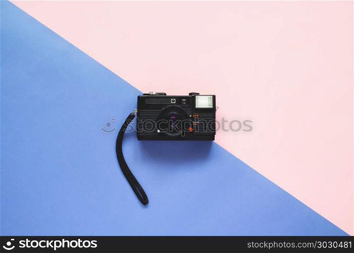 Flat lay camera film on pastel colors background