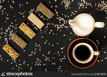 flat lay cereal bars assortment with milk coffee plain background