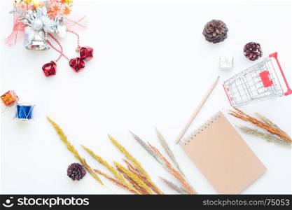 Flat lay Christmas and winter items with shopping cart on white background, Online shopping in winter