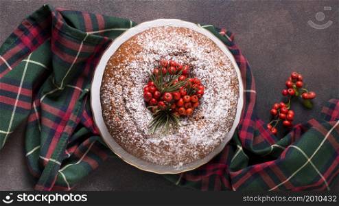 flat lay christmas cake with red berries