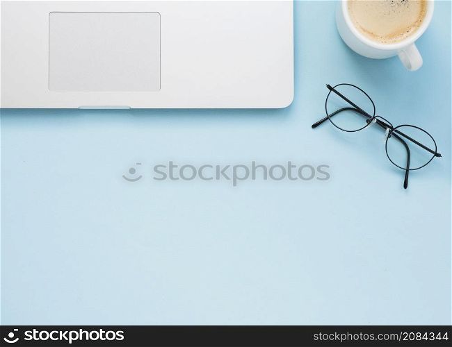 flat lay clean office desk with blue background