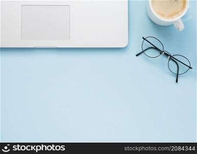 flat lay clean office desk with blue background