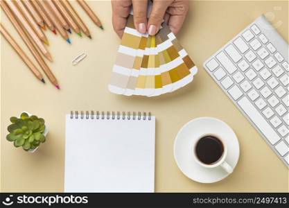 flat lay color palette house renovation with notebook colored pencils