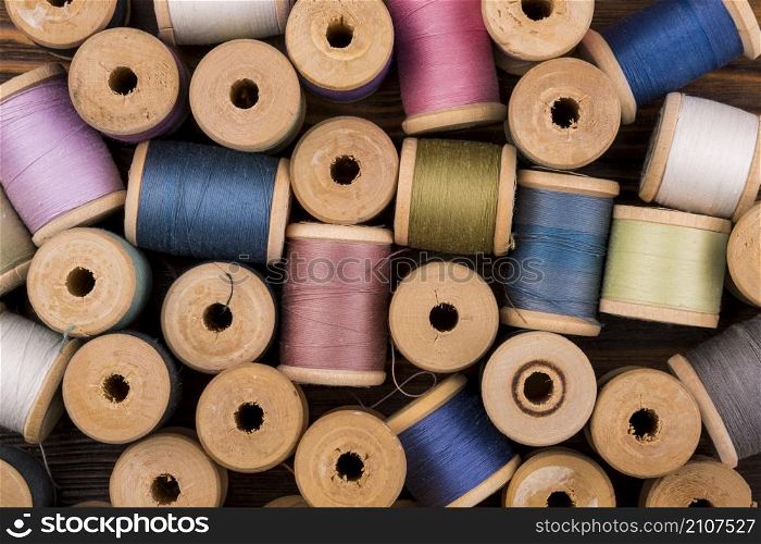 flat lay colored thread spools