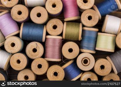 flat lay colored thread spools