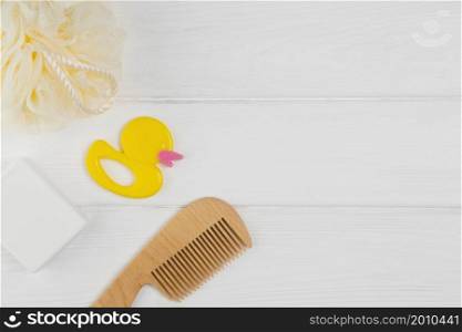 flat lay comb with ducky loofah baby shower
