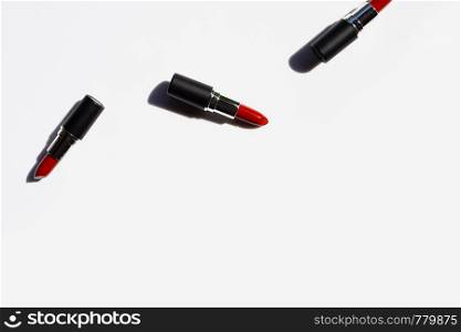 Flat lay composition, Lipsticks on white background with shadow. Beautiful Make-up concept with copy space