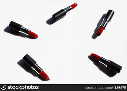 Flat lay composition, Lipsticks on white background with shadow. Beautiful Make-up concept