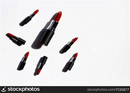 Flat lay composition, Lipsticks on white background with shadow. Beautiful Make-up concept