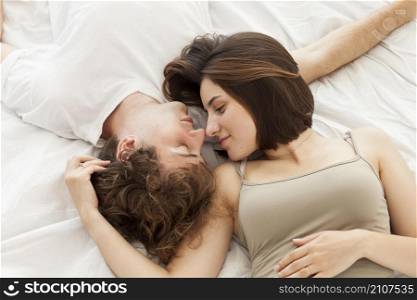 flat lay couple laying bed