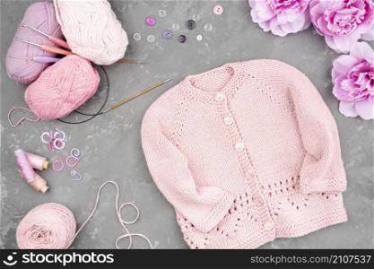 flat lay crocheted pink jacket