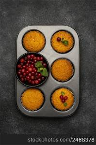 flat lay delicious muffins with berries pan
