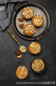 flat lay delicious muffins with nuts 2