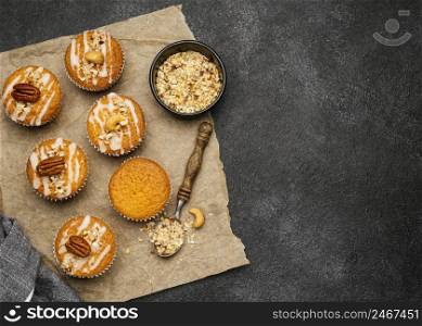 flat lay delicious muffins with nuts copy space