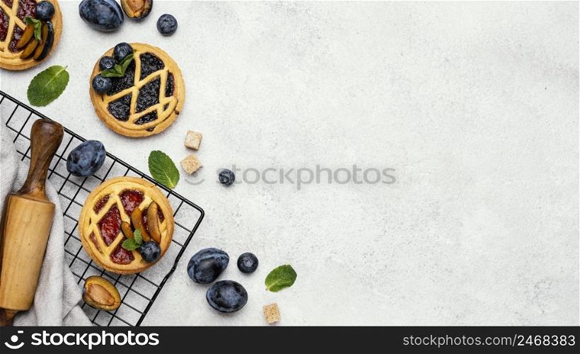 flat lay delicious pies with fruits copy space