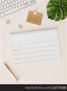 flat lay desk calendar with monstera leaf pencil box