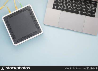 flat lay desk with laptop wireless router