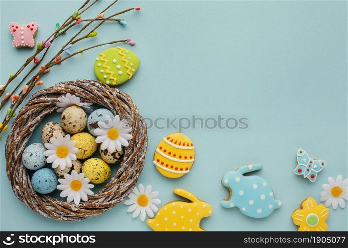 flat lay easter eggs basket with chamomile flowers bunny shape. Beautiful photo. flat lay easter eggs basket with chamomile flowers bunny shape