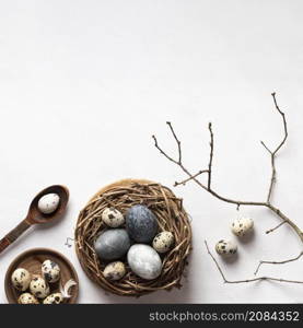 flat lay easter eggs bird nest with copy space twig