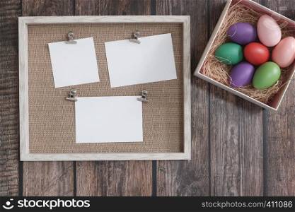 Flat-lay Easter eggs on wooden table
