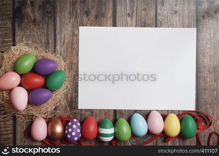 Flat-lay Easter eggs on wooden table