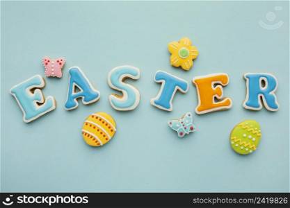 flat lay easter eggs with flower butterfly shapes