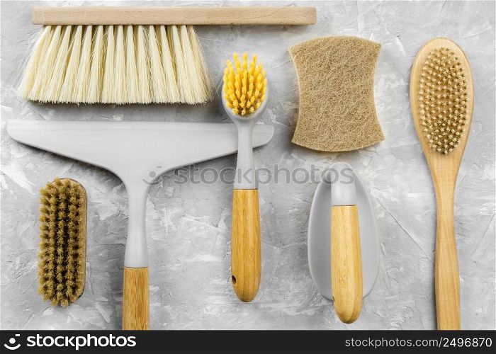 flat lay eco friendly cleaning products with selection brushes